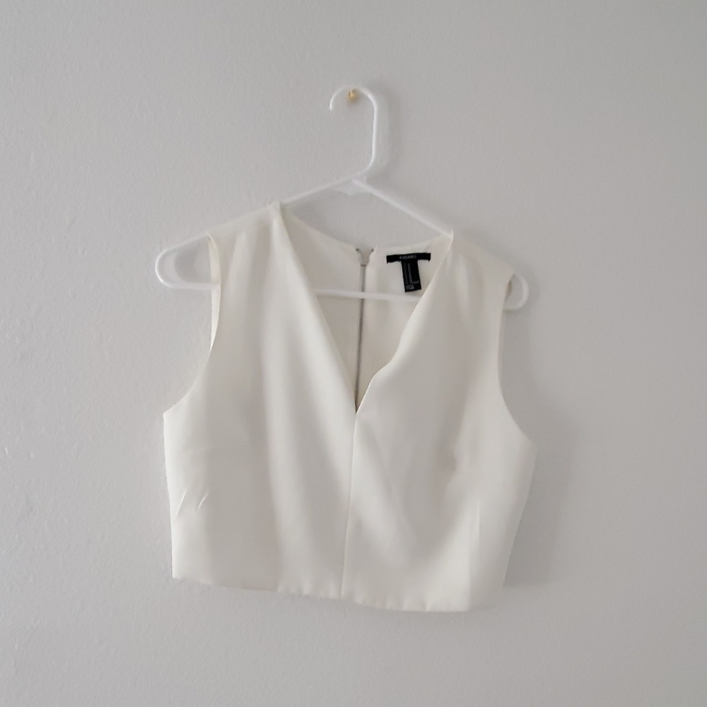 Selling a white crop top with zipper in back